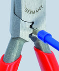 Close-up of Six And A Quarter Inch Electricians Four In One Pliers cutting a blue wire with induction hardened precision cutting edges.