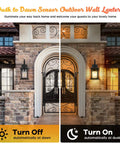 Two Pack Dusk To Dawn Outdoor Wall Lanterns In Black Matte Aluminum showing off and on modes at a doorway.