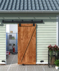 6Ft Black Exterior Sliding Barn Door Hardware Track Kit Beefy Heavy Duty Rail System for Outdoor Walls, installed view