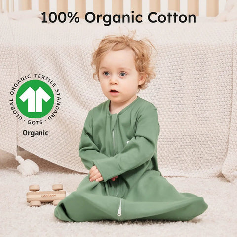 Toddler wearing green Cozy Sleeved Baby Sleep Sack For 0 To 6 Months Lightweight 0.5 Tog Wearable Blanket Made From 100 Percent Cotton