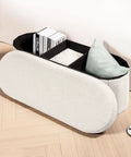 Go To Storage Ottoman With Cozy Sherpa Lining showcasing divided storage compartments with books and pillow inside.