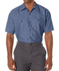 Mens Short Sleeve Work Shirt Regular Fit Polyester Cotton Blend Button Front Utility Top All Day Comfort Heavy Duty Job Site Ready Built Tough For The Daily Grind 4XL Large Postman Blue model wearing shirt with two front pockets.