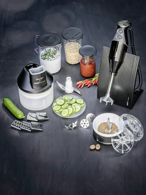 Game Changing One Liter Blending Pitcher With Comfortable Handle Crisp Graduations BPA Free, various kitchen items and a black immersion blender.