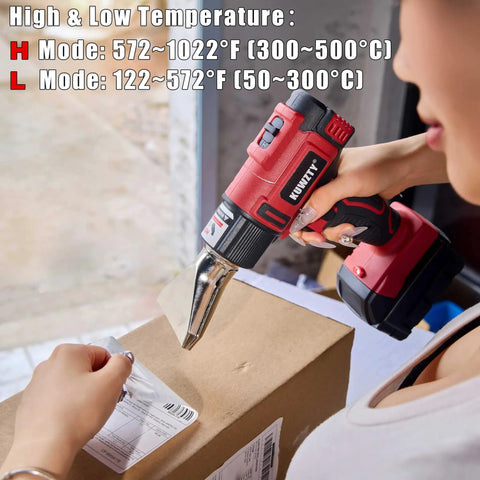 Person using Cordless Heat Gun For Milwaukee M18 Battery Two Temperature Settings Up To 1022 F 550 C on cardboard box