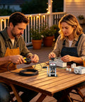 Heavy Duty Manual Wire Stripping Machine With Ergonomic Hand Crank And Drill Adapter used by man and woman for cable stripping outdoors.