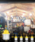 Gig Worthy Construction String Lights 75W 7500LM 5000K illuminating a cluttered attic with tools and materials.