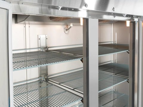 Interior view of Heavy Duty Three Door Commercial Reach In Freezer with stainless steel and aluminum interior, showcasing six racks.