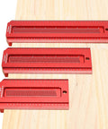 Three red metal Woodworking Saddle T Square Ruler Six Inch For Carpenter Layout And Measuring Tools on a wooden board