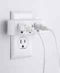 Premium Grounded Outlet Extenders Four Pack Triple Socket Wall Power Splitter plugged into wall with two cords attached.