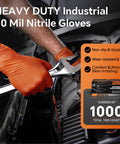 Close-up of orange 10mil nitrile disposable gloves (XL) worn by a mechanic using a wrench