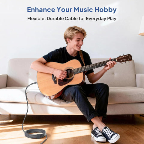 Man playing acoustic guitar on couch with Rugged Quarter Inch TRS Guitar Cable 10ft 2-Pack Straight 6.35mm Instrument Cord