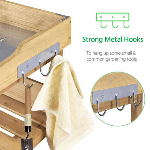 Close-up of strong metal hooks on outdoor garden potting bench with metal top storage shelf, part of fir wood workstation.
