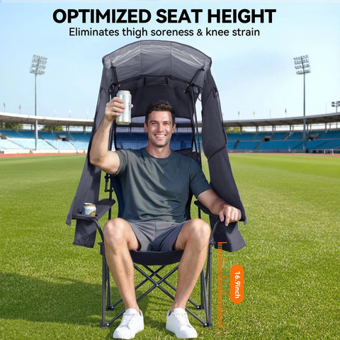 Man sitting in Grab And Go Camping Chair With Canopy Shade And UPF Fifty Plus Protection, holding drink on sports field