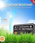 Badass Yard Setup 12 X 6 Inch No Trespassing Dog On Premises Sign 2 Pack Heavy Aluminum displayed in grass under sunlight.
