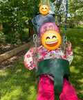 Toddler in high-back EVA swing seat with iron chains, outdoor setup from Toddler And Kids Swing Seat Set For Indoor Outdoor Fun, Green Pack Of 2