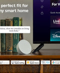 Next Level HD Media Stick Player With Clutch Voice Remote on a table near books, showcasing smart home usage.