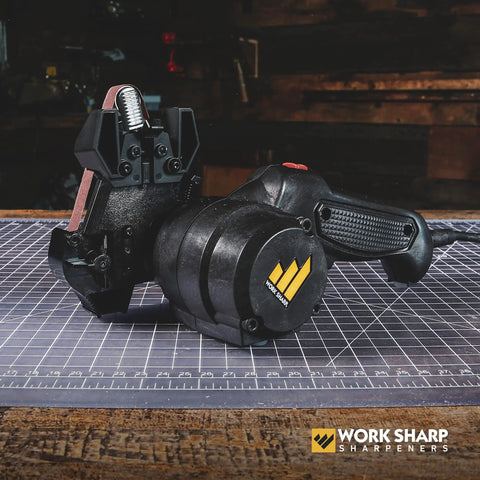 Mk2 Professional Electric Knife And Tool Sharpener With Adjustable Sharpening System, shown with flexible belts on a workbench