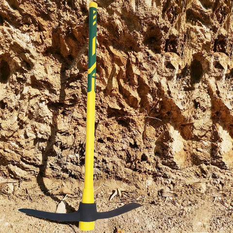 Beast Mode Heavy Duty Forged Mattock With Adze And Ergonomic Non Slip Handle in outdoor setting, 36-inch tool for tough jobs