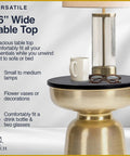 Hourglass Accent Side Table With Natural Granite Top And Brushed Brass Base, Modern End Table, 16 inch diameter, with coffee mug and glasses