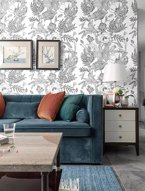 Living room with Peel And Stick Black White Lotus Lily Damask Wallpaper Mural For Easy DIY Decor behind a blue sofa