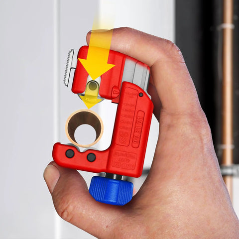 Three Inch TubiX S Pipe Cutter With QuickLock One Handed Adjustment for copper and stainless steel pipes in hand, cutting a pipe