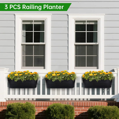 Three Pack 16 Inch Railing Planter Boxes With Detachable Wide Hooks for 2.7 Inch Railings, on balcony planted with flowers.