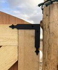 Rustic Barn Door Corner Brackets Set 4.9 In Matte Black L Shape Sliding Door Hardware installed on outdoor wooden gate