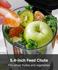 AMZCHEF Cold Press Juicer With 5.4 Inch Slow Masticating Wide Feed Chute showing whole fruits and leafy greens in the 5.4-inch feed chute.