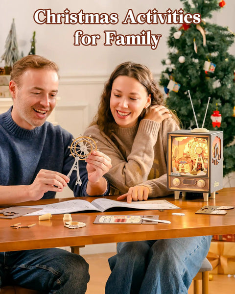 Christmas Activities for Family: couple assembling DIY Book Nook Puzzle Kit With 16 Inch Ferris Wheel Music Box, LED Lights, Sunset Carnival Scene, 3D Wooden Puzzle For Adults, Totally Artsy Craft Gift Set For Girls And Boys, Detailed Nighttime Display