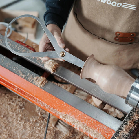Heavy Duty Boss Level Double Ended Bowl Caliper Stainless Steel Measuring Gauge used for wall thickness checks on a woodturned vessel.