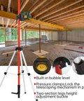 Heavy Duty Telescoping Laser Level Pole With Adjustable Tripod Mount Kit in action at a construction site.