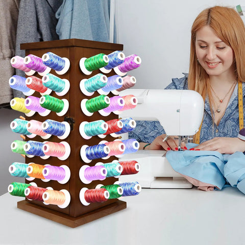 Pretty Slick Wooden 84 Spool Thread Rack With 360 Degree Rotation And Hidden Compartments For Sewing Embroidery Craft Threads Storage Organizer And Needles Bobbins with colorful threads.