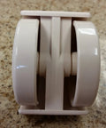 Almond Chromcraft caster wheel, dual-wheel plastic furniture caster, side view