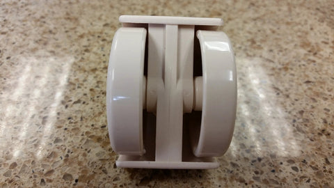 Almond Chromcraft caster wheel, dual-wheel plastic furniture caster, side view