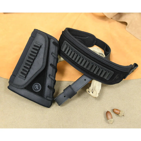 Durable Leather Rifle Stock Cover With Built In Recoil Pad And Cartridge Sling For Calibers Including .357 .30-30 .45-70 Mag .22LR .22 Mag .17 HMR And 12 Gauge Shotguns Black Set, shown with detachable sling on a beige surface.