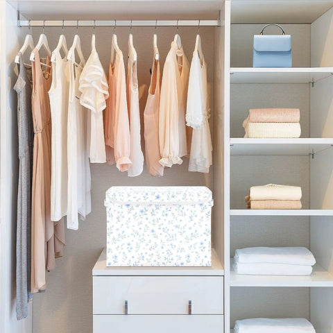 Built Tight Foldable Storage Bin With Heavy Duty Handles And Velcro Close Top For No Sweat Organization in a closet with dresses.