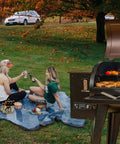 RTD Temperature Probe Sensor For Wood Pellet Grills 700 And 820 Series High Temperature Meat Probe Replacement Plug And Play Durable Sensor For Precise Even Cooking And Consistent Grilling outdoor pellet grill with two women picnic beside open smoker
