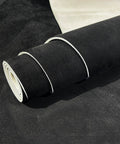 Headliner fabric roll, black suede with foam backing for automotive roof replacement; close-up view.