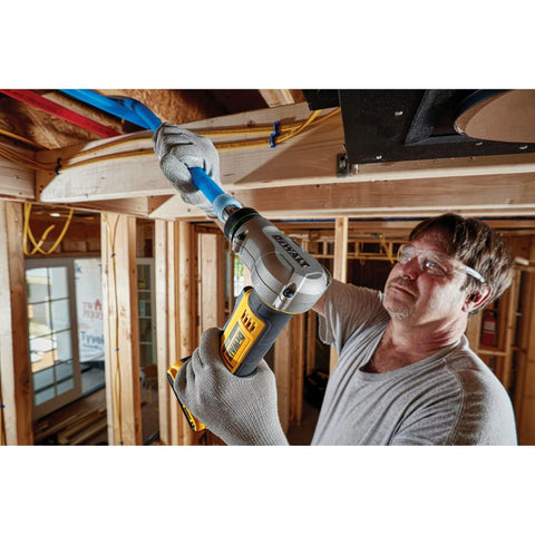 Man using 20V Max PEX Expander Tool Kit For 1 Inch Tubing With Automatic Rotating Head in construction setting