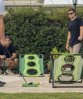 Adults playing Backyard Golf Cornhole Game For Adults And Men, A Dope Chipping Practice Session That Feels Like Real Golf outdoors.