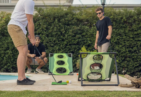 Adults playing Backyard Golf Cornhole Game For Adults And Men, A Dope Chipping Practice Session That Feels Like Real Golf outdoors.
