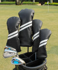 4 Piece Golf Head Cover Set For Drivers Fairway Woods And Hybrids With Interchangeable Tags Waterproof Black Protection No Hassle Universal 460cc Driver Fit Durable Plush Fur Easy On And Off For All Woods And Hybrids displayed on golf bag at a course.