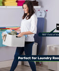 Woman holding laundry basket with Motion Sensor Light Switch With PIR and Ambient Light Detection installed in laundry room wall.