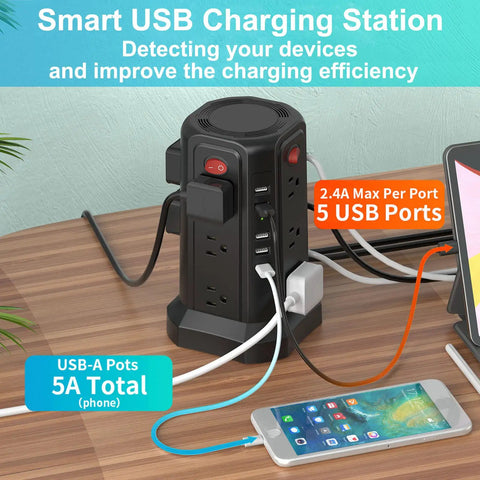 17-in-1 Tower Power Strip Surge Protector with 12 AC Outlets and 5 USB Ports on a desk, charging multiple devices.