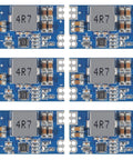 Front view of Six Five Volt Five Amp Mini560 Buck Converter Modules for DIY projects, showing components on blue PCB.