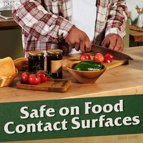Person chopping vegetables on a wood surface, showcasing Pro Grade 100 Percent Pure Tung Oil Wood Finish That Penetrates Deep, Food Safe And Waterproof Sealer.