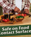 Person preparing vegetables on wood, showcasing 100 Percent Pure Tung Oil For Wood Finish And Sealer, 32 Fl Oz, 2 Pack, food-safe surface.