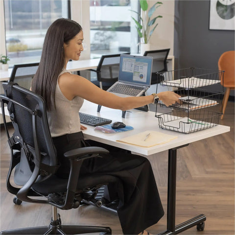 Person organizing papers in a Wire Desk Tray Organizer For Letter And Legal Size Papers Black 5 Inch Buildable File Bin on a desk.