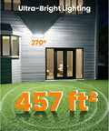 Lit outdoor scene with Solar Fence Lights With 526 LEDs, Motion Sensor, 270 Degree Wide Angle, mounted on house wall