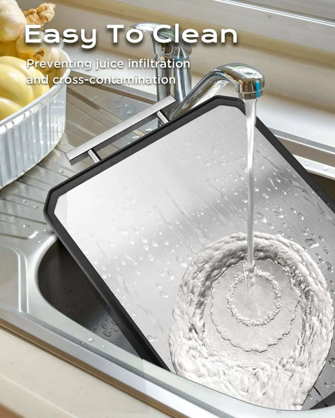 Double Sided Stainless Steel Meat Cutting Board And Wheat Straw Veggie Board Large 16 By 11 Inch Kitchen Workhorse being rinsed